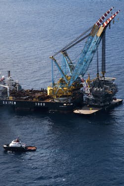 Crowley tugs deliver to Tubular Bells Crowley tugs deliver to Tubular Bells