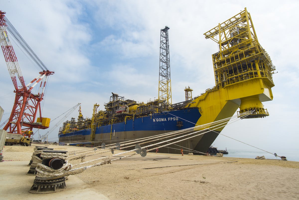 The N&apos;Goma FPSO, shown at quayside in the Paenal shipyard, has sailed for block 15/06 offshore Angola.