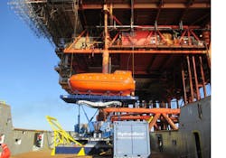 This photo shows a lifeboat on the Ampelmann system right before installation. This photo shows a lifeboat on the Ampelmann system right before installation.