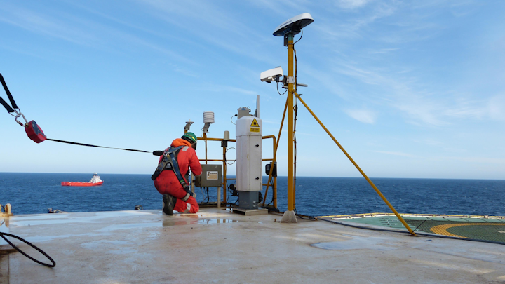 A Fugro engineer installs an enhanced monitoring system to the Ocean Guardian's existing helideck system.