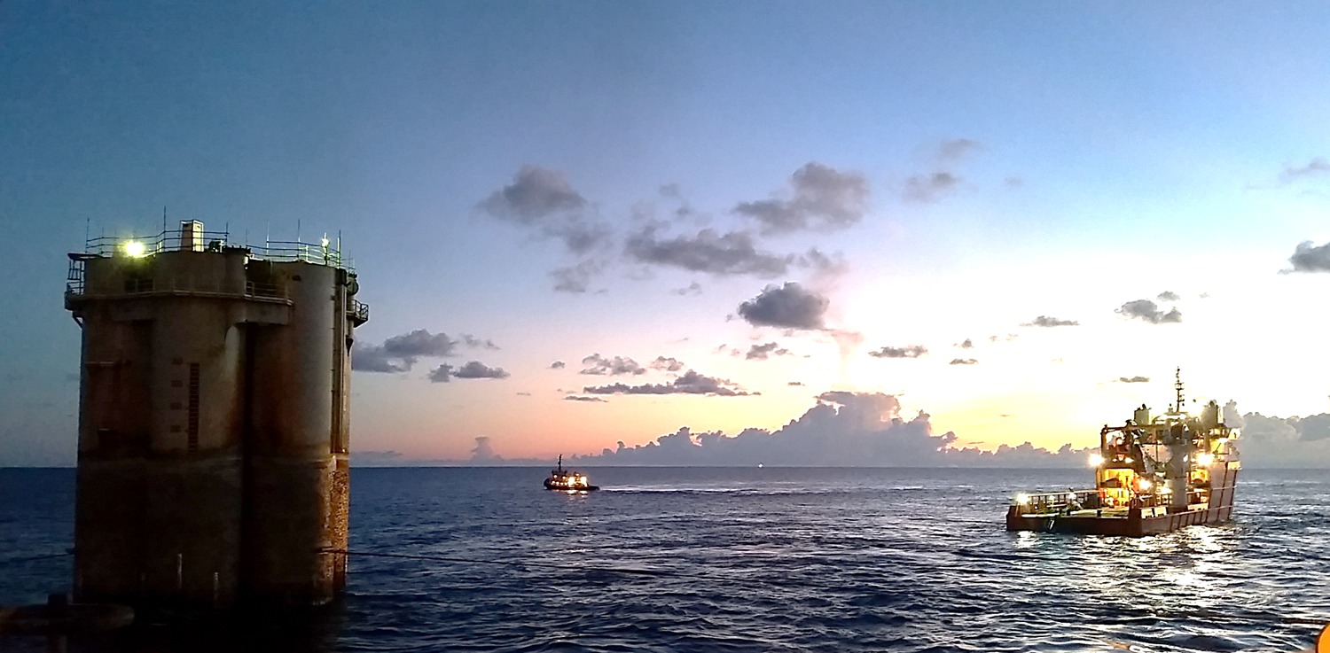 The Red Hawk spar is towed to a reefing site.