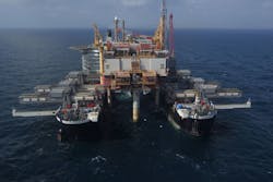 Pioneering Spirit moves in to remove the Yme MOPU Pioneering Spirit moves in to remove the Yme MOPU