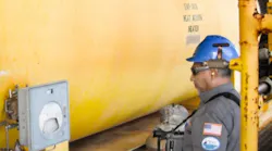 BSEE technician inspects offshore oil and gas facility with infrared camera