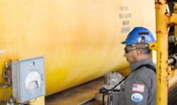 BSEE technician inspects offshore oil and gas facility with infrared camera