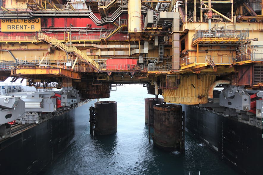 The Pioneering Spirit moving the Brent Bravo topsides away from the three 12-m (39-ft) diameter steel-reinforced concrete legs.