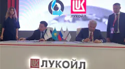 KMG CEO Alik Aidarbayev and Lukoil President Vagit Alekperov signing the I-P-2 heads of agreement.