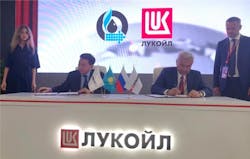 KMG CEO Alik Aidarbayev and Lukoil President Vagit Alekperov signing the I-P-2 heads of agreement.