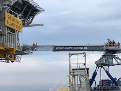 An E-type walk-to-work system was used to transport personnel from the Normand Jarstein vessel to the normally unmanned platform in the Norwegian North Sea. An E-type walk-to-work system was used to transport personnel from the Normand Jarstein vessel to the normally unmanned platform in the Norwegian North Sea.