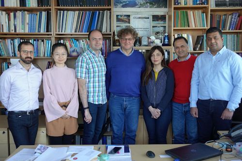Professor Marian Wiercigroch, Director of CADR, is pictured (center) with members of the CADR team.