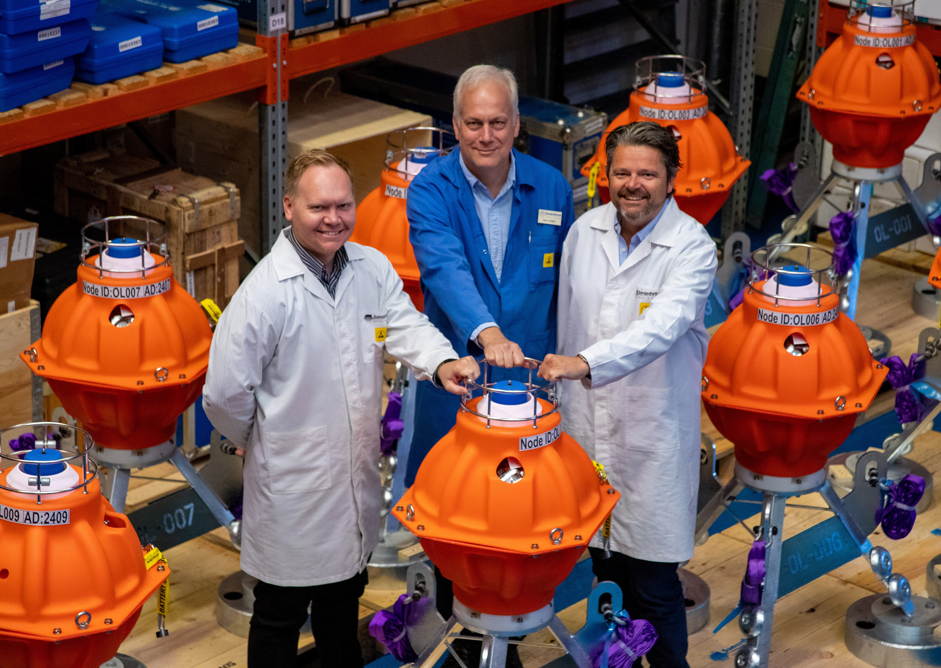 Norske Shell&rsquo;s HSE Advisor, Mats Hauge, Sonardyne&rsquo;s Senior Project Manager, Nick Street, and Norske Shell&rsquo;s Senior Project Surveyor, Tomas Frafjord, inspect the first batch of fetch pressure monitoring transponders heading to the Ormen Lange field.