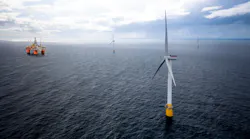 Hywind floating wind turbines withe the Snorre A semisubmersible platform in the distance.