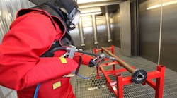 Operator decontaminating equipment with ultra-high-pressure water jet. Operator decontaminating equipment with ultra-high-pressure water jet.