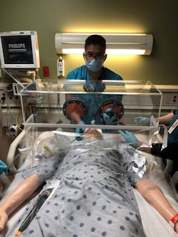 Dr. Luis Chug demonstrates how his newly introduced ViraBox protects patients and healthcare workers from exposure to the coronavirus. Dr. Luis Chug demonstrates how his newly introduced ViraBox protects patients and healthcare workers from exposure to the coronavirus.