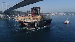 The semisubmersible drilling rig Scarabeo 9 sailing under a bridge on the Bosphorus Strait. The semisubmersible drilling rig Scarabeo 9 sailing under a bridge on the Bosphorus Strait.