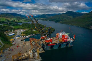 The Sleipnir offloading the jacket onto the quayside at the AF Milj&oslash;base decommissioning site in Vats, Norway.