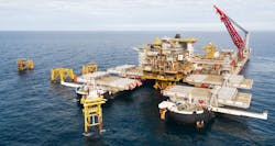 The Pioneering Spirit with the 7,800-metric ton (8,598-ton) Tyra West Alpha processing platform topsides. The Pioneering Spirit with the 7,800-metric ton (8,598-ton) Tyra West Alpha processing platform topsides.
