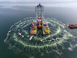 The heavy lift vessel Svanen installing a monopile at the Kriegers Flak offshore wind farm in the Danish sector of the Baltic Sea. The heavy lift vessel Svanen installing a monopile at the Kriegers Flak offshore wind farm in the Danish sector of the Baltic Sea.