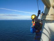 A Pd&amp;ms Rope Access Technician Working At A Wind Farm, Off The Coast Of Scotland