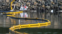 Crews deploy skimmers and booms to stop further incursion into the Wetlands Talbert Marsh in Huntington Beach, California, on Oct. 3, 2021.