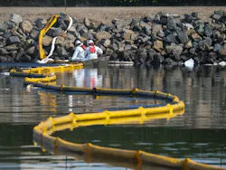 Crews deploy skimmers and booms to stop further incursion into the Wetlands Talbert Marsh in Huntington Beach, California, on Oct. 3, 2021. Crews deploy skimmers and booms to stop further incursion into the Wetlands Talbert Marsh in Huntington Beach, California, on Oct. 3, 2021.