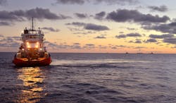 Offshore workboat moves toward derrick barge and other vessels in the Bass Strait offshore Australia. Offshore workboat moves toward derrick barge and other vessels in the Bass Strait offshore Australia.