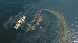 An oily sheen appears on the water’s surface just before the Couvillion Group installed an underwater oil containment system at the site of the damaged Taylor Energy production platform in 2019.