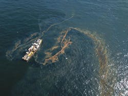 An oily sheen appears on the water&rsquo;s surface just before the Couvillion Group installed an underwater oil containment system at the site of the damaged Taylor Energy production platform in 2019.