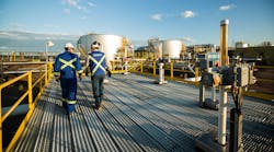 Workers walk through the Sunrise Energy Project in the Canadian oil sands in Northern Alberta, Canada. Operations started at the Sunrise Phase 1 in-situ oil sands project in December 2014.