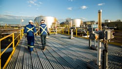 Workers walk through the Sunrise Energy Project in the Canadian oil sands in Northern Alberta, Canada. Operations started at the Sunrise Phase 1 in-situ oil sands project in December 2014. Workers walk through the Sunrise Energy Project in the Canadian oil sands in Northern Alberta, Canada. Operations started at the Sunrise Phase 1 in-situ oil sands project in December 2014.