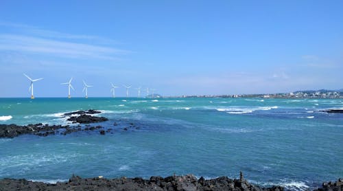 This is the scenery of the offshore windmill (wind power generation) in Jeju Island, Korea.