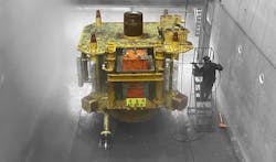 A worker focuses on subsea tree cleaning and marine growth removal. A worker focuses on subsea tree cleaning and marine growth removal.