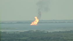 A fire burns on Lake Lery after a loose barge hit a natural gas pipeline on Thursday, Sept. 8, 2022.