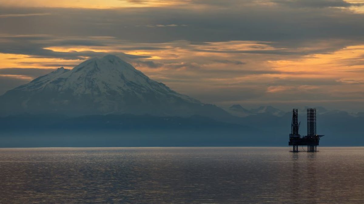 An oil and gas platform operates in the Cook Inlet offshore Alaska.