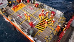 Rig workers being transported to offshore rigs by boat Rig workers being transported to offshore rigs by boat