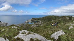 Holnsøy seascape in June 2023: HNET consortium members gather around a geophone station that is part of the HNAR onshore array monitoring the subsurface microseismic activity in the future CO2 storage area. Holnsøy seascape in June 2023: HNET consortium members gather around a geophone station that is part of the HNAR onshore array monitoring the subsurface microseismic activity in the future CO2 storage area.