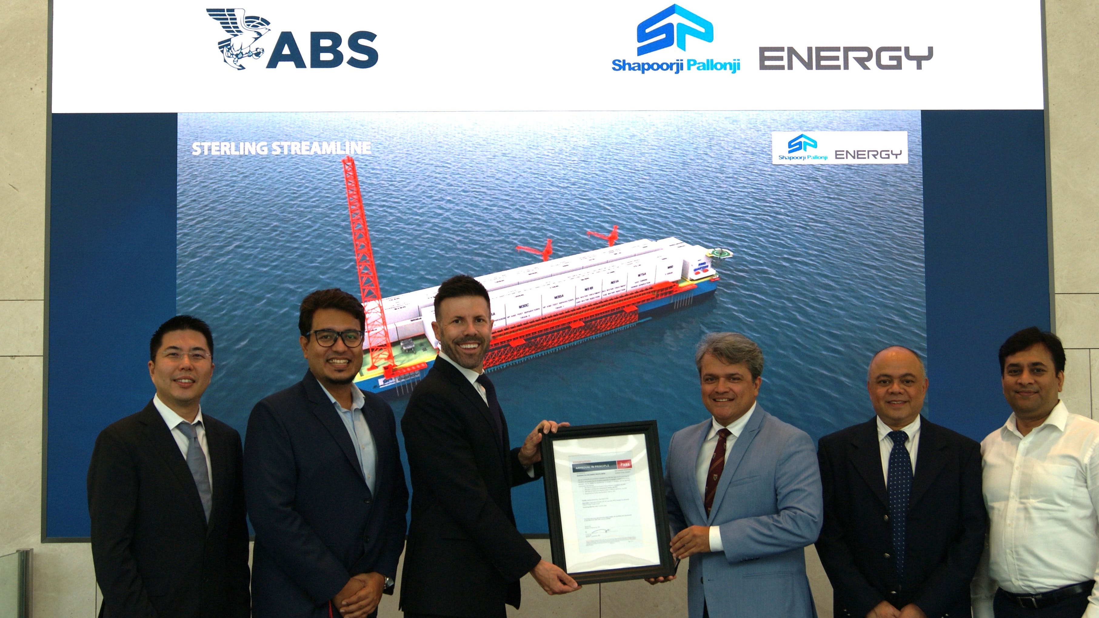 ABS Director of Business Development Ben Ford (center left) and Shapoorji Pallonji Energy President Projects Ankit Garg (center right) hold the ABS AiP certificate.