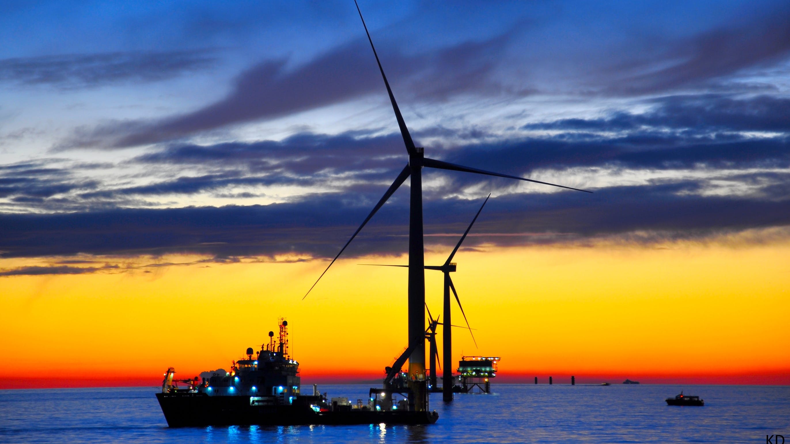 657376e64eaf79001e1fe666 Offshore Wind Sunset Dreamstime L 20870334