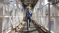 A worker walks along an offshore platform at Chevron's Anchor Field, a deepwater development with reservoir depths reaching 34,000 ft below the water surface. A worker walks along an offshore platform at Chevron's Anchor Field, a deepwater development with reservoir depths reaching 34,000 ft below the water surface.