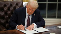 Trump signs orders Trump signs orders