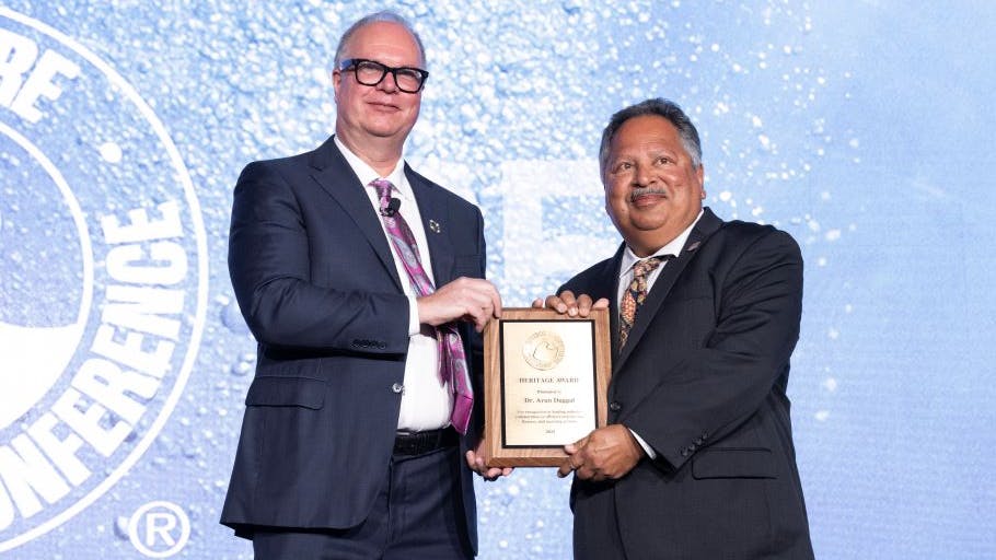 Alex Martinez presented the 2025 Heritage Award to Dr. Arun Duggal