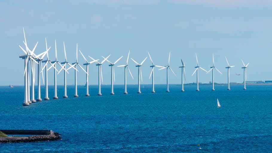 A stock art image of offshore wind turbines