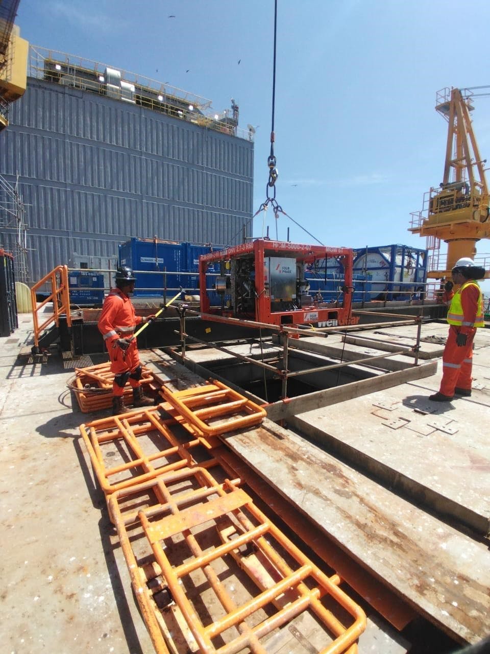 Two FourPhase workers onshore prepping for Shell sand management project.