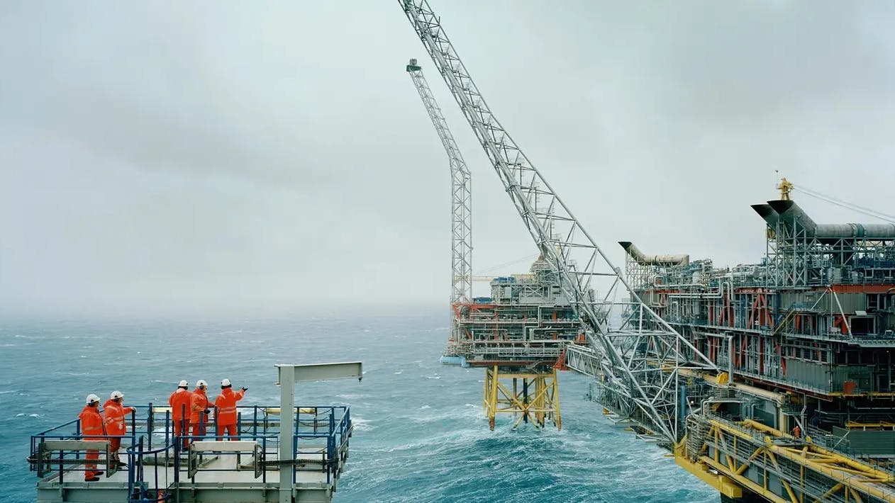 Five workers are seen at the offshore Oseberg Field Centre.