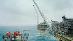 Five workers are seen at the offshore Oseberg Field Centre. Five workers are seen at the offshore Oseberg Field Centre.