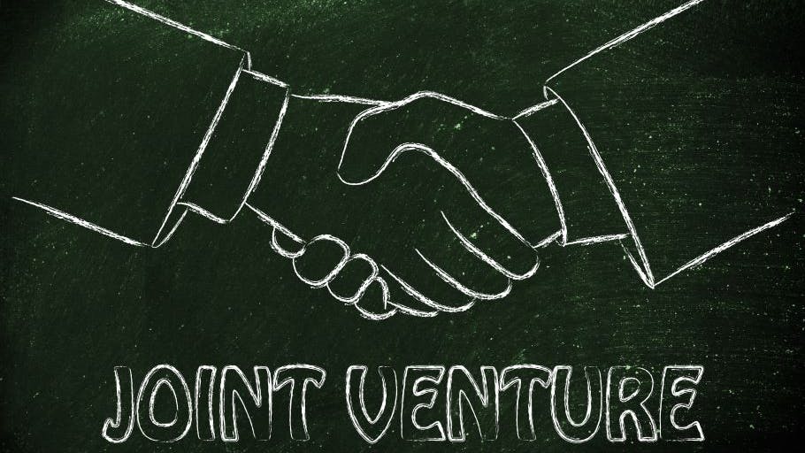 illustration of hands shaking and the words joint venture.