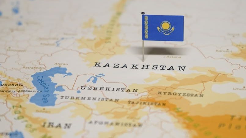 Map shows flag of Kazakhstan with nearby countries.