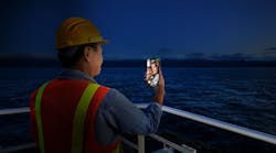 An AI-generated image depicts an offshore crew member video chatting with family. An AI-generated image depicts an offshore crew member video chatting with family.