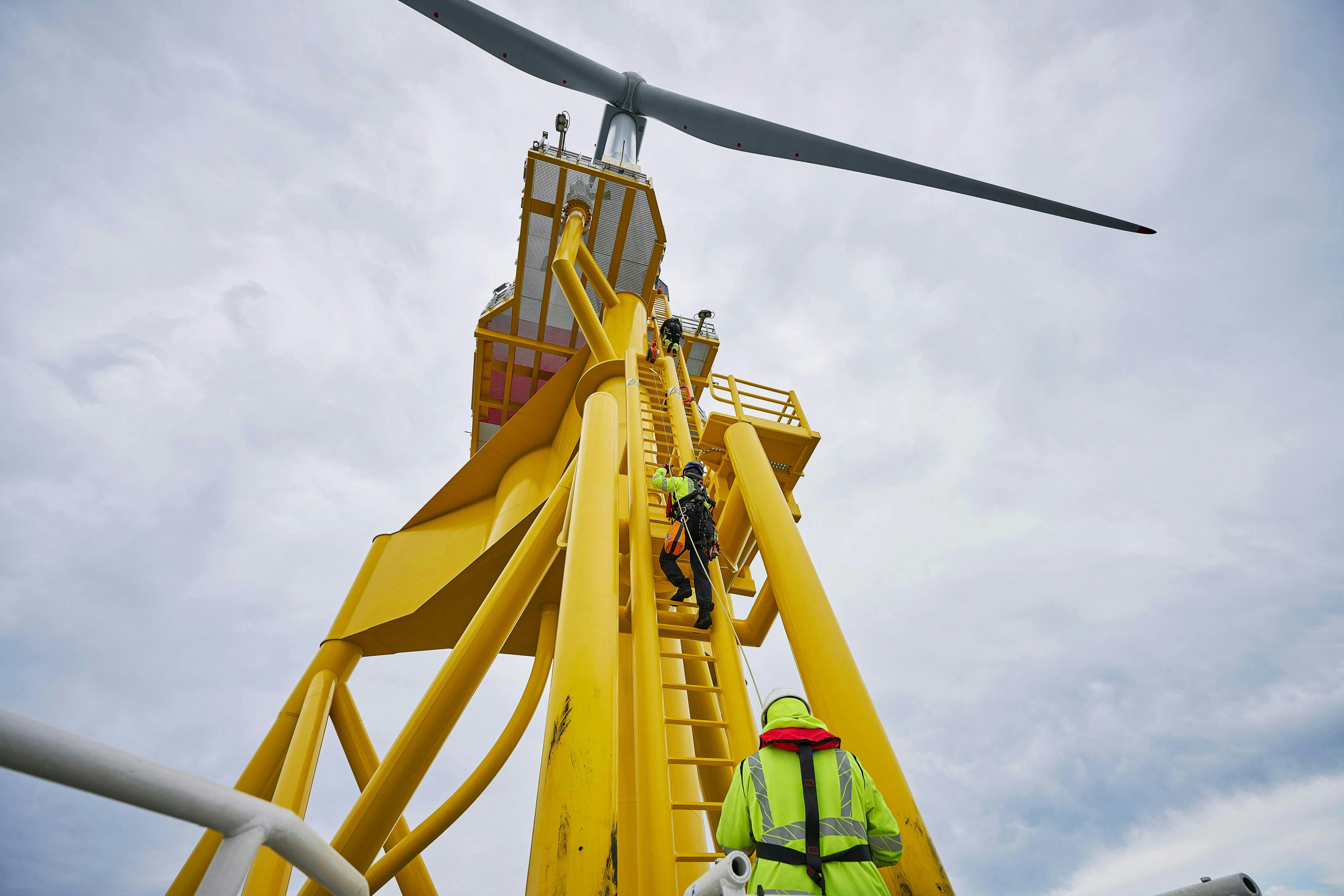 Technicians work on offshore wind equipment Technicians work on offshore wind equipment