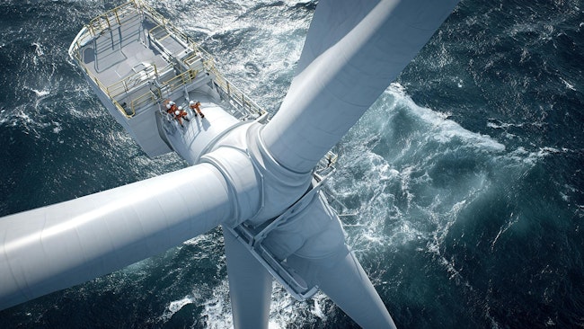 Workers conducting maintenance on a large offshore wind turbine