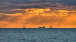 Offshore drilling rigs and a vessel in the Gulf of Mexico Offshore drilling rigs and a vessel in the Gulf of Mexico